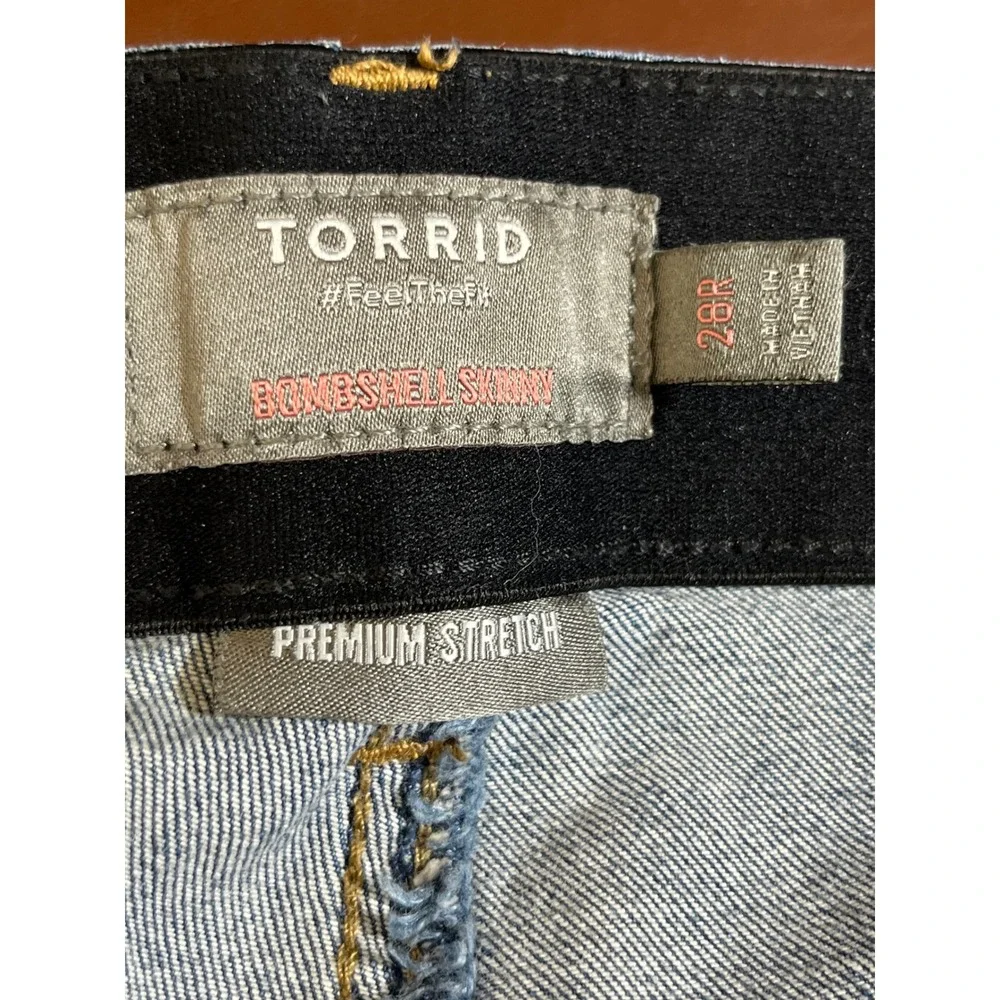 Torrid Bombshell Skinny Jeans 28R Medium Wash Distressed Ripped Raw Hem Blue